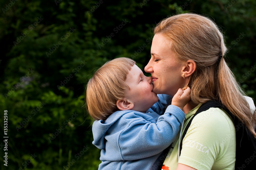 Kisses and hugs between mother and doughter Kisses and hugs between mother and doughter