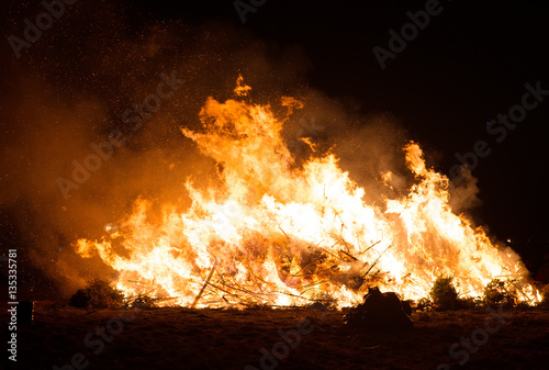 Burning of many Christmas trees after holidays.