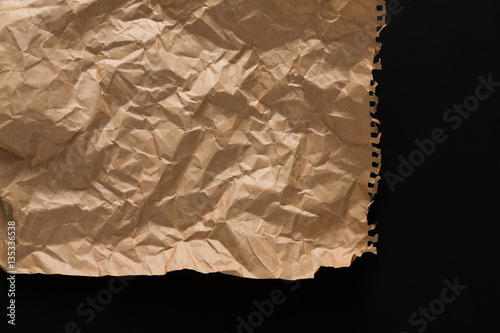 old paper sheet isolated on black background