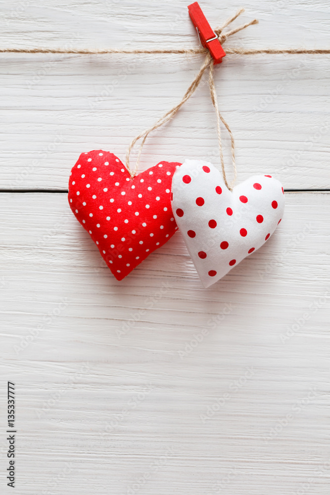 Fototapeta premium Valentine day background, pillow hearts couple on wood, copy space