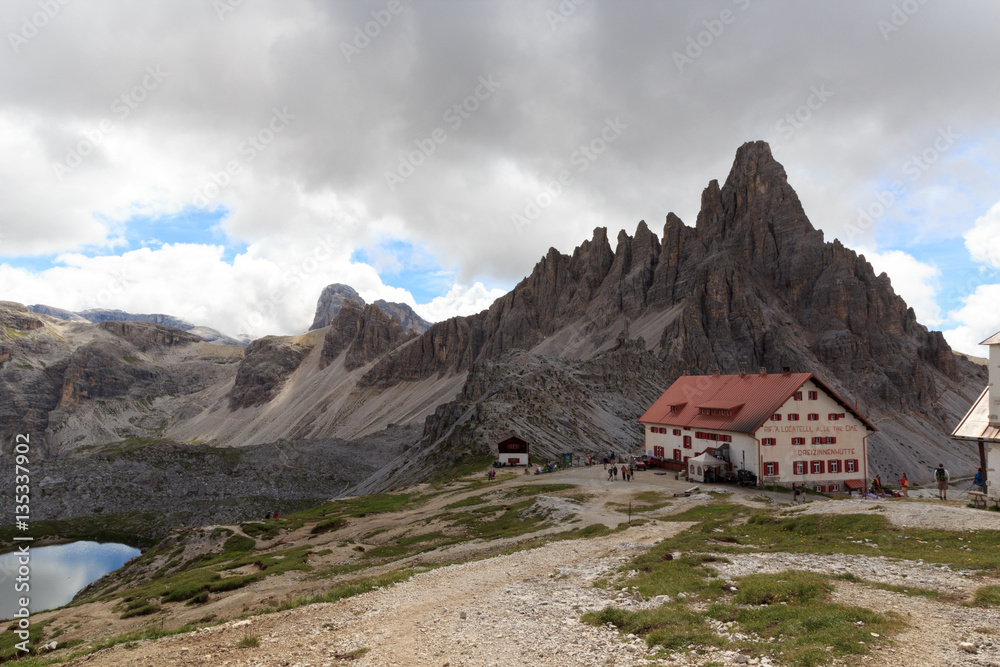 Mountain Paternkofel and alpine hut Dreizinnenhütte in Sexten Dolomites, South Tyrol, Italy