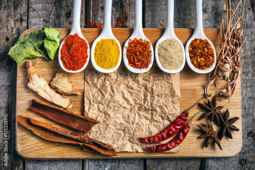 Fototapeta Naklejka Na Ścianę i Meble -  Various colorful spices on wooden table