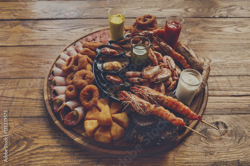 Seafood platter on wooden table background