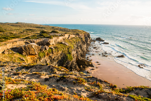 Empty beach and cliff tops on Praia de Marinha