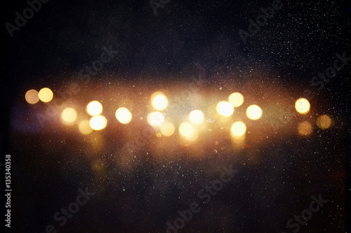 glitter lights background. gold and black © tomertu