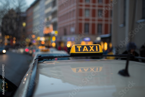 Taxi sign on car roof