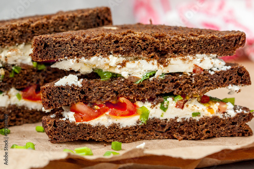 Sandwiches with healthy rye bread, feta and green onions. Love for a healthy food concept