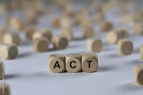 act - cube with letters, sign with wooden cubes
