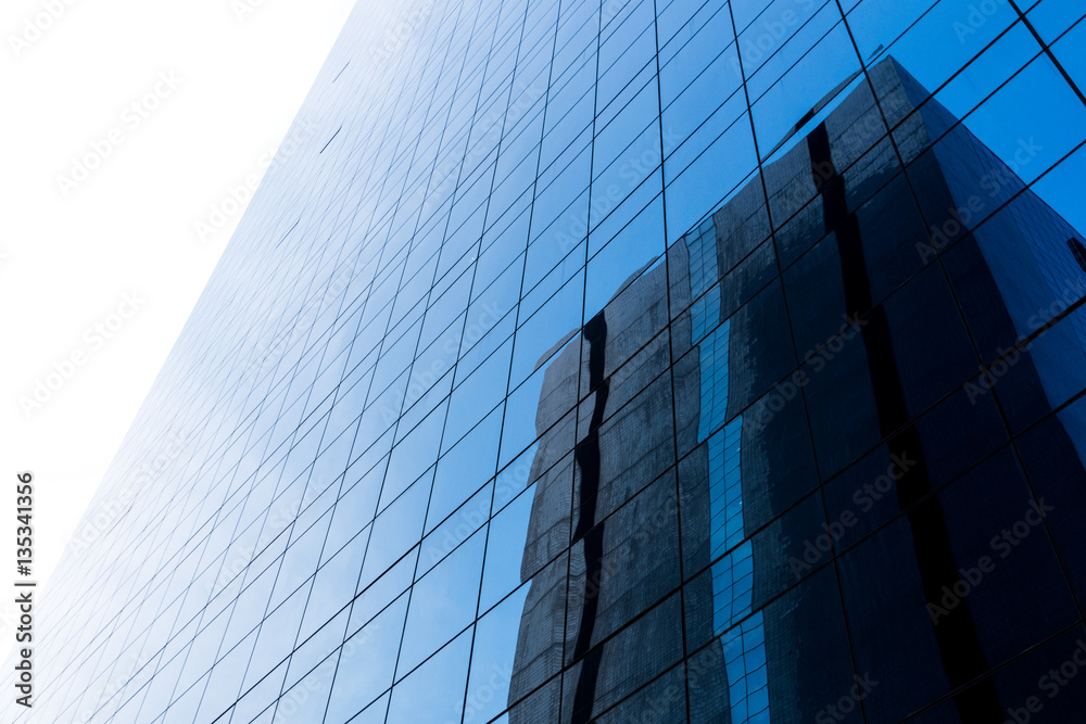 Backgrounds of Modern blue architecture with reflection Backgrounds of Modern blue architecture with reflection