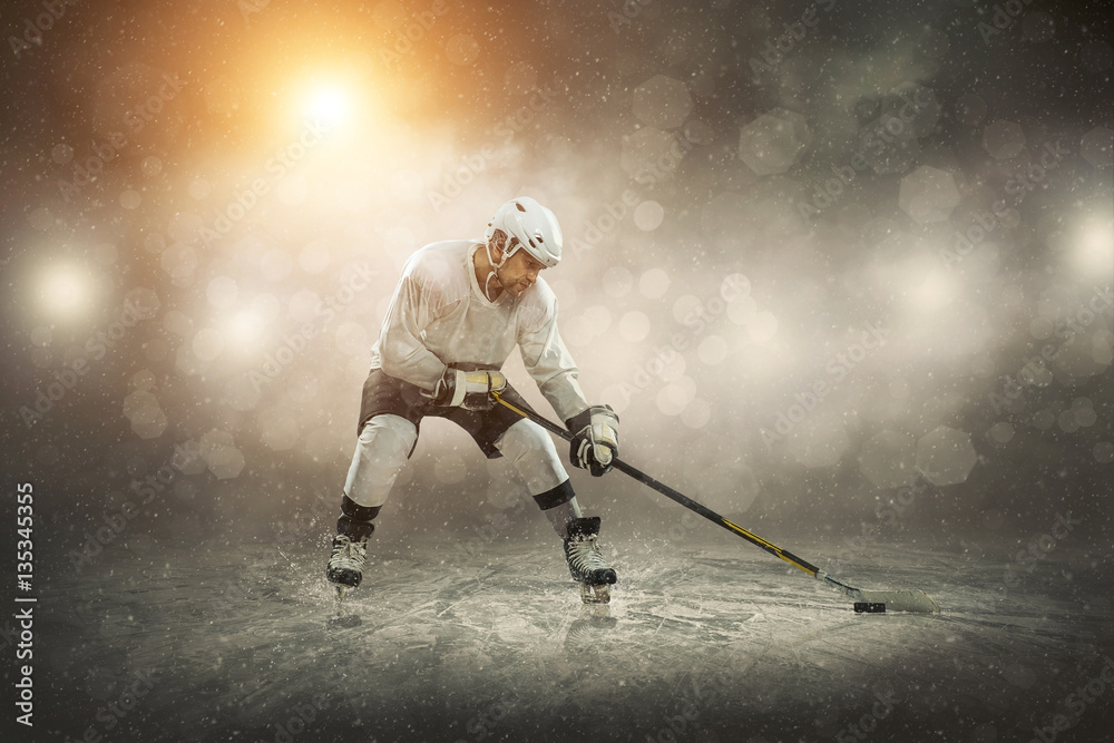 Fototapeta premium Ice hockey player on the ice, outdoors