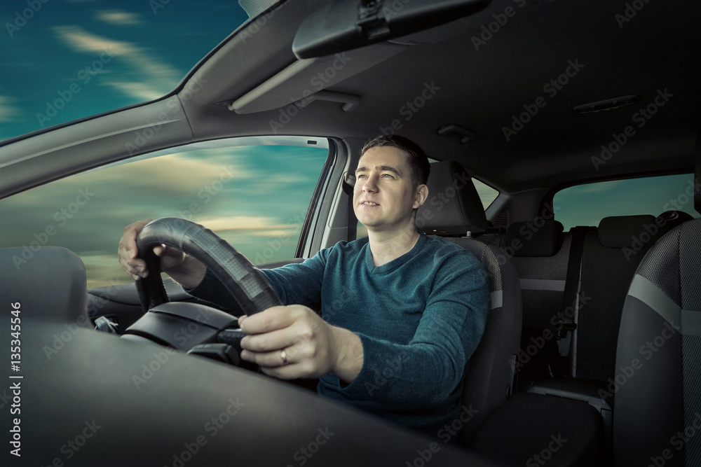 Man sitting and driving in the car. Man sitting and driving in the car.