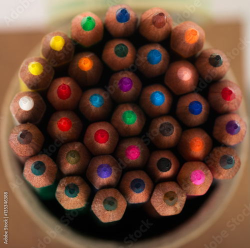 Multicolored pensils in the box