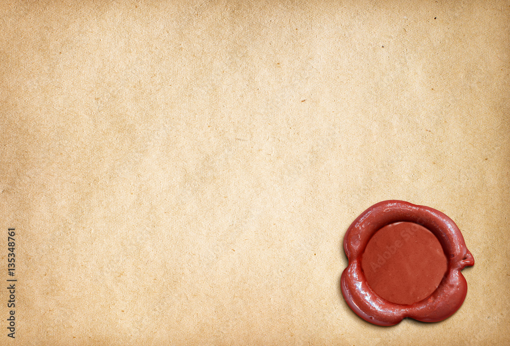 Old ragged parchment roll with red wax seal, Stock image