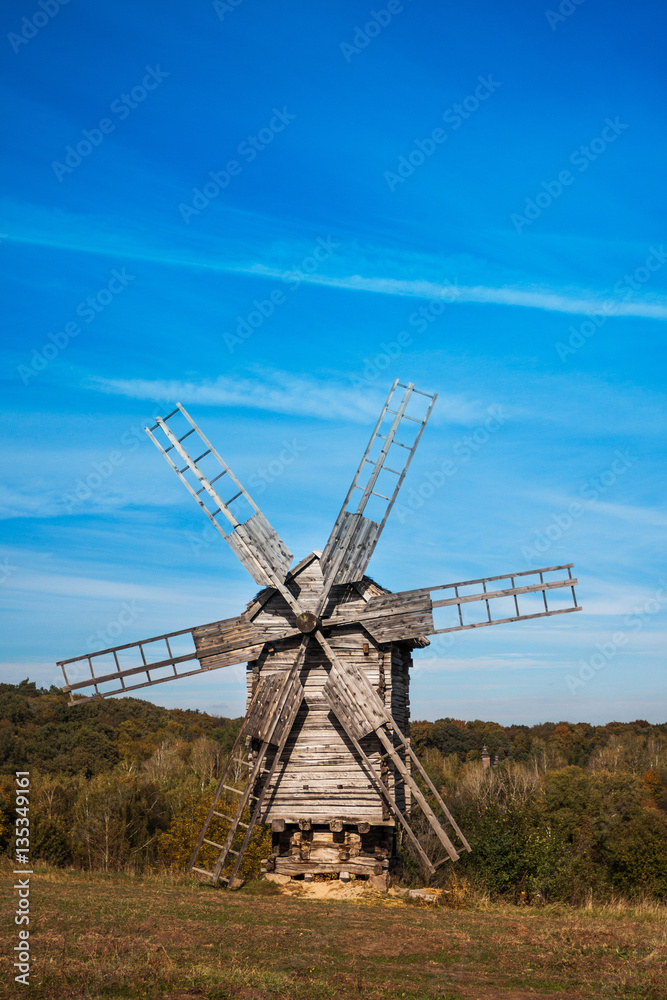 Old wooden windmill on the hill.