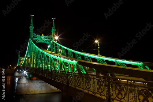 Western side of Liberty Bridge connecting Buda and Pest across Dunabe River in Budapest, Hungary photo