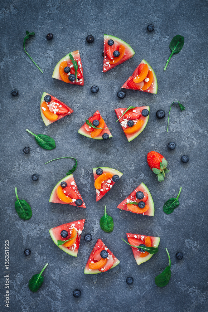 Fruit pizza made of watermelon, strawberry, blueberry, apricot. Flat lay, top view