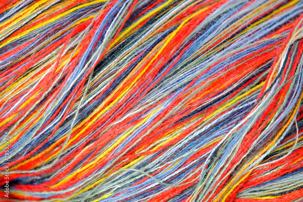 Close up multicolored  cotton yarn for use in handicrafts. Detail and textured background.