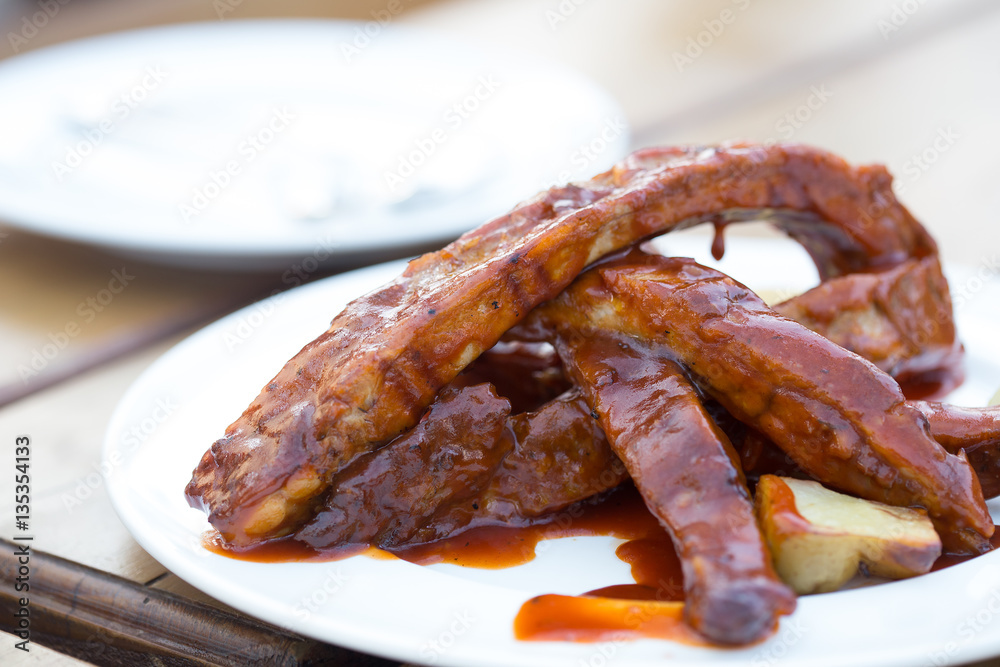Delicious BBQ baby-back ribs with a tangy sauce Delicious BBQ baby-back ribs with a tangy sauce