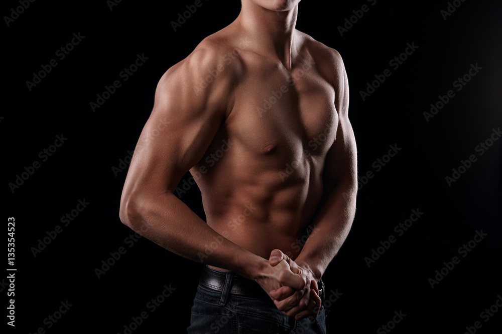 Handsome man posing and showing his arm muscles Handsome man posing and showing his arm muscles