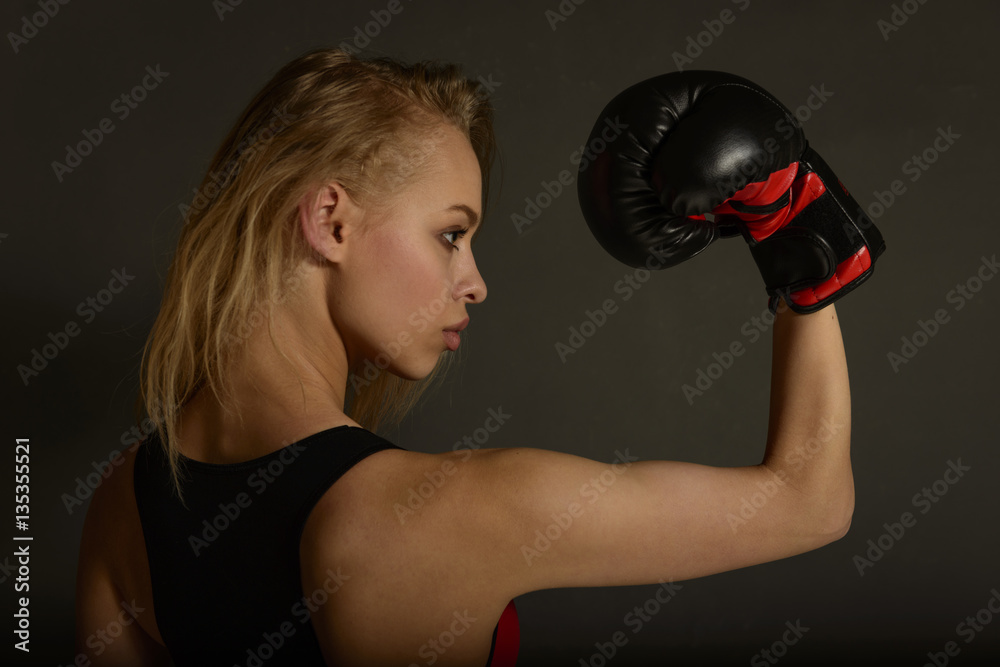 Fit slim young beautiful blonde woman boxing in sportswear. Photo set of sporty muscular female girl wearing sports clothes over gray background