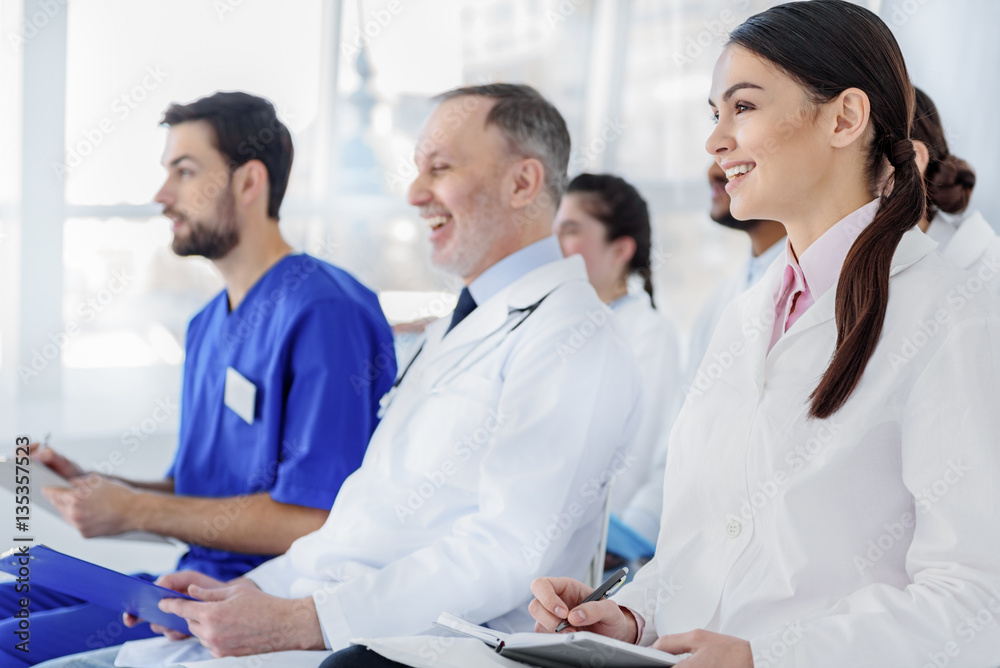 Happy doctors enjoying lecture at clinic Happy doctors enjoying lecture at clinic