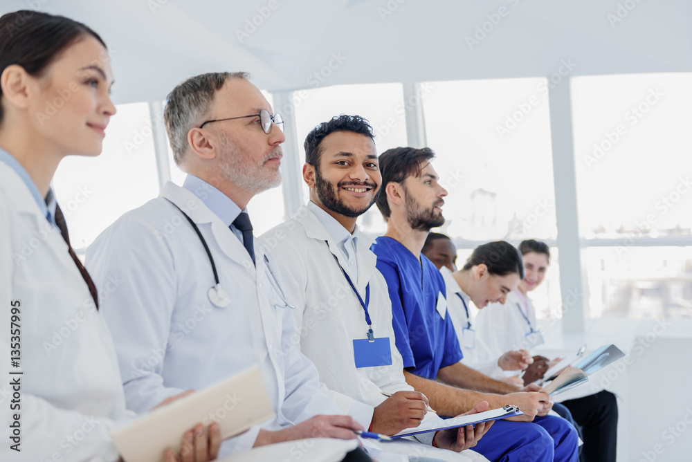 Professional doctors making notes with interest Professional doctors making notes with interest