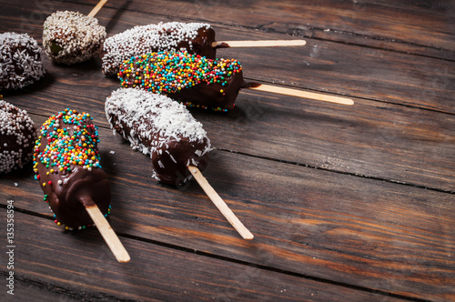 Chocobanana - traditional dessert in Guatemala of frozen banana dipped into hot chocolate photo