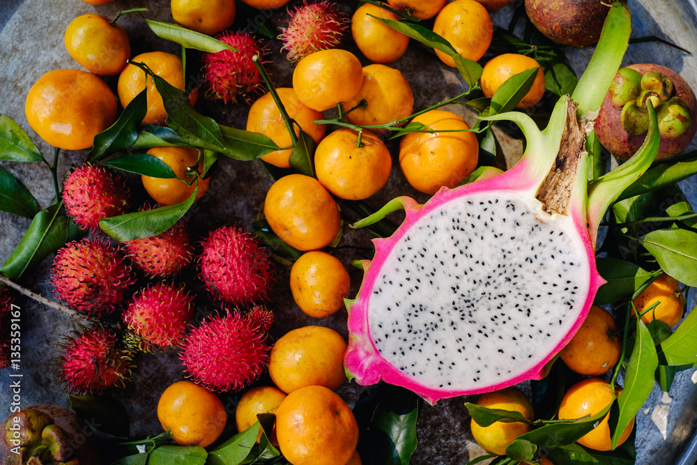 Fototapeta Healthy tropical fruit and ingredients from top view