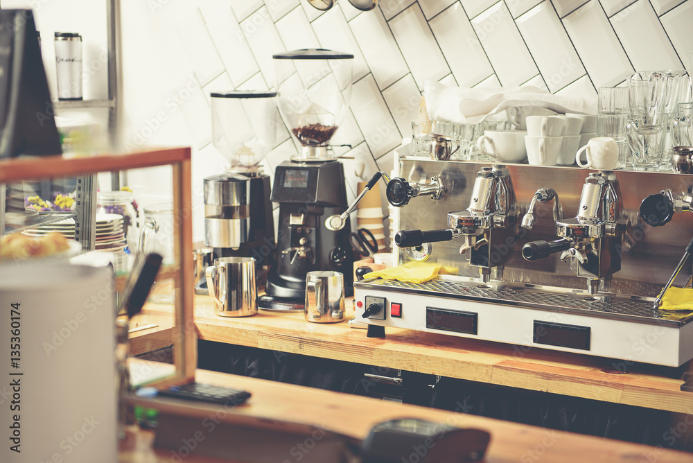 Fototapeta premium Different appliances on under-counter cabinets in espresso bar