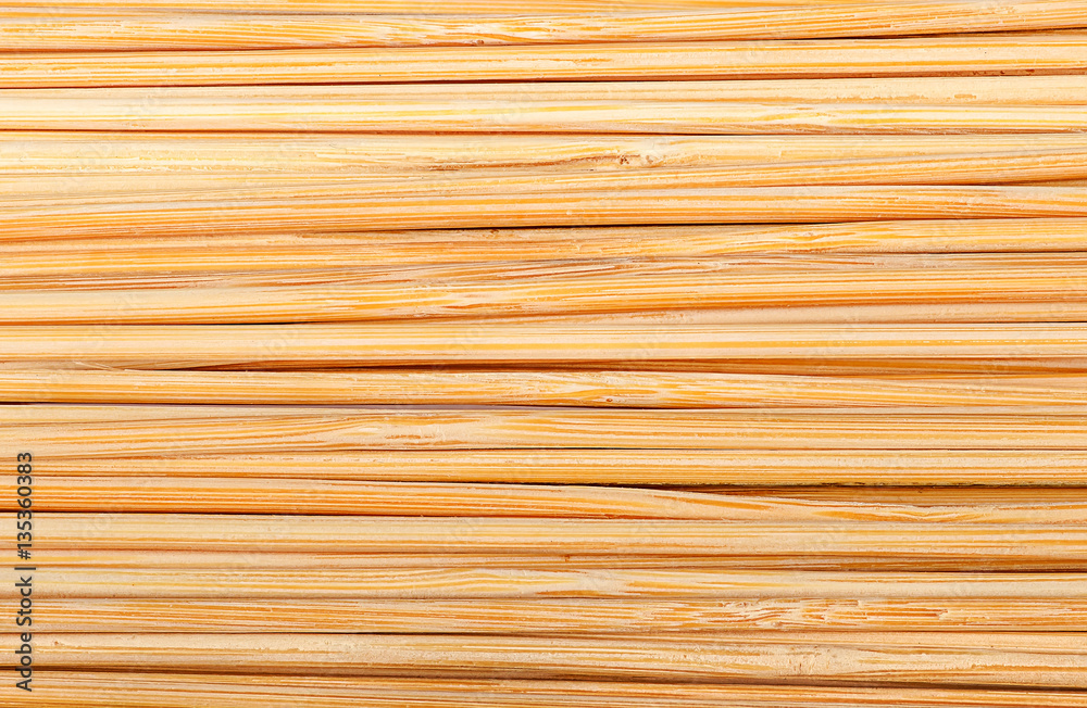 Bamboo sticks stacked next to each other Bamboo sticks stacked next to each other