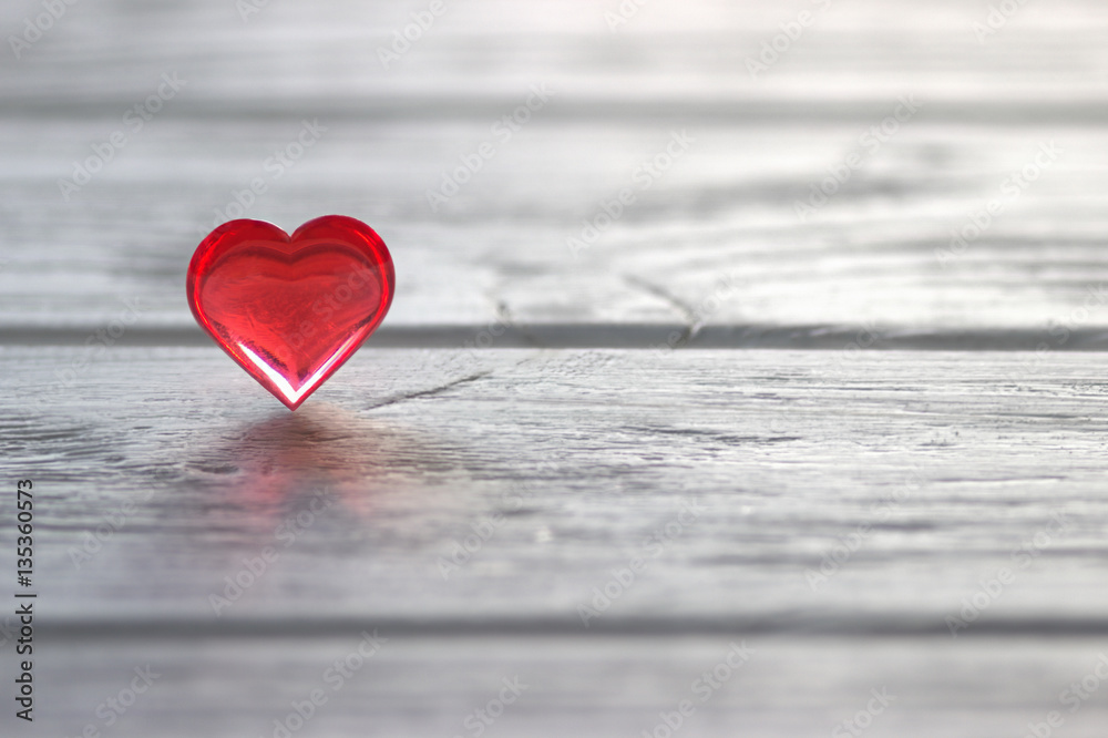 Red Heart on the gray painted wooden background Red Heart on the gray painted wooden background