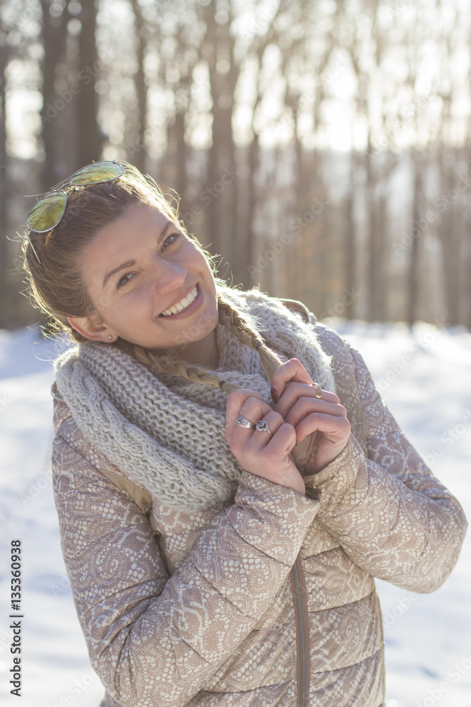 Fototapeta premium Portrait of beautiful girl on snow