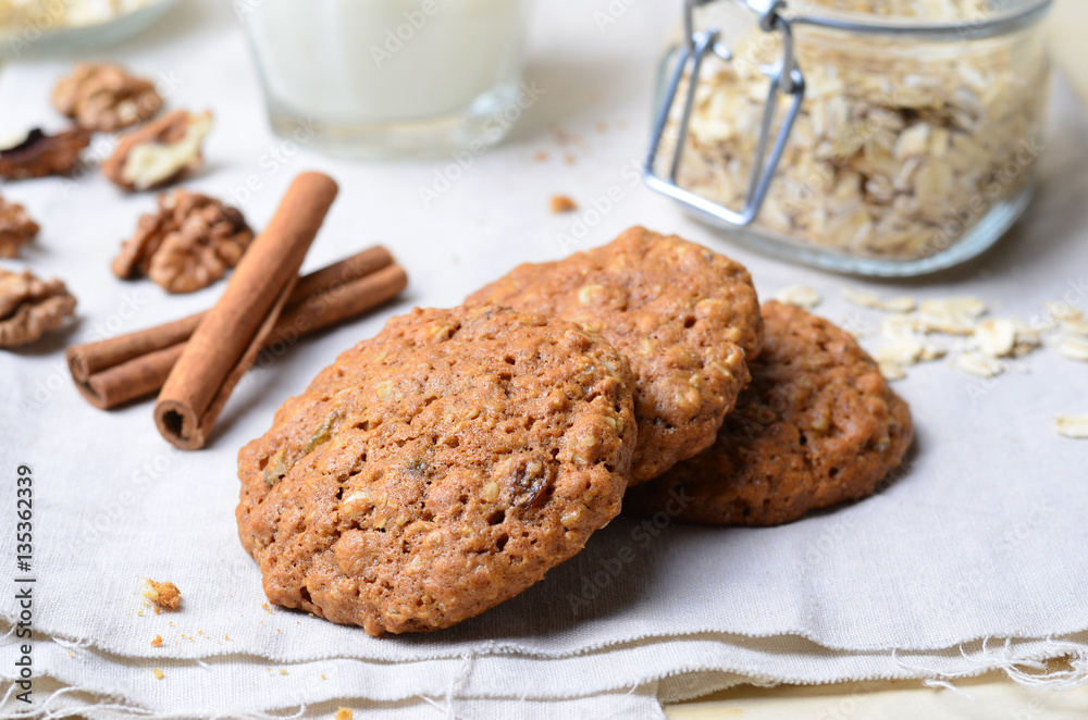 Homemade Oatmeal Cookies with Walnut and Cinnamon on bright background Homemade Oatmeal Cookies with Walnut and Cinnamon on bright background