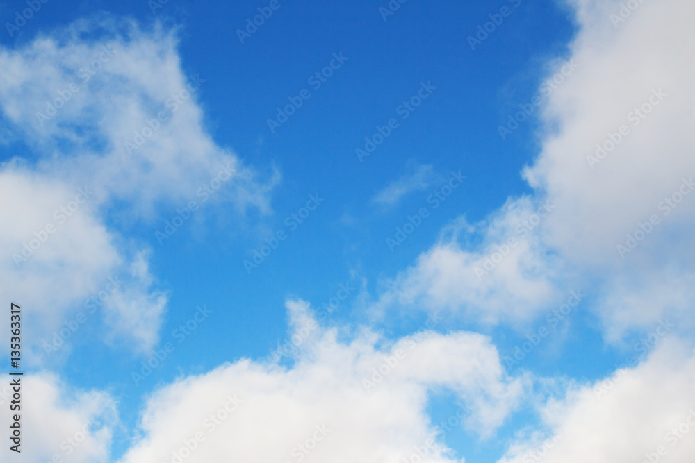 White clouds in a bright blue sky. Sunny day White clouds in a bright blue sky. Sunny day