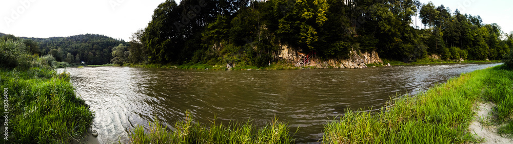 Panorama of muddy river Poprad and surrounding forest Panorama of muddy river Poprad and surrounding forest