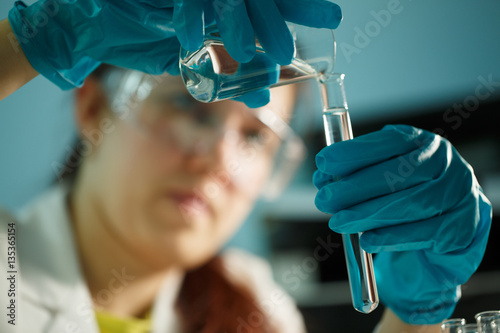 Lab assistant conducting chemical tests