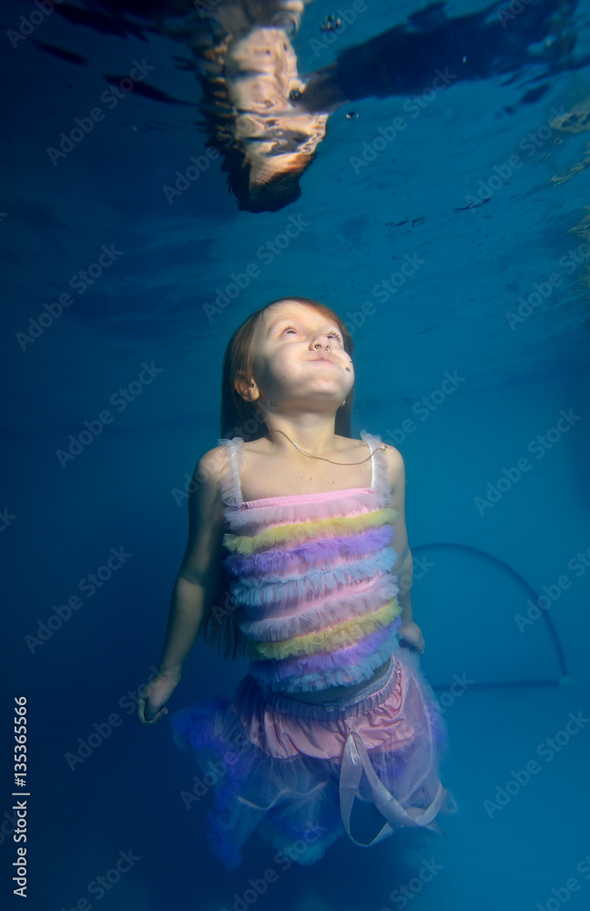 Little girl underwater in a pretty dress POPs up from the bottom to the ...