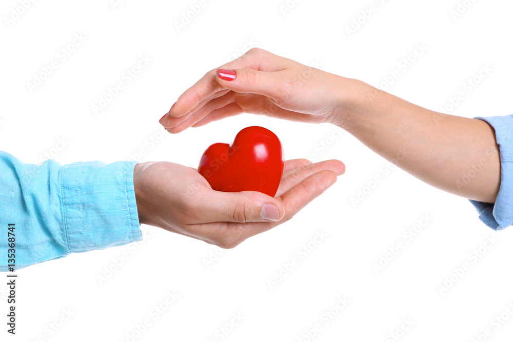 Fototapeta premium Couple hands with red heart on white background
