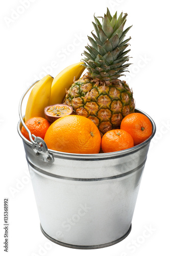 Fruit mix in tin bucket.