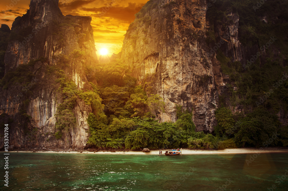 Sunset on beautiful beach in Thailand, Asia. Monumental rocks with green trees, sunset sky. Sunset on beautiful beach in Thailand, Asia. Monumental rocks with green trees, sunset sky.