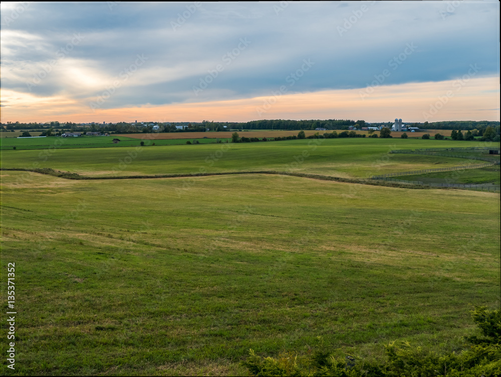 Fototapeta premium Sunset Over Rural Farm Land