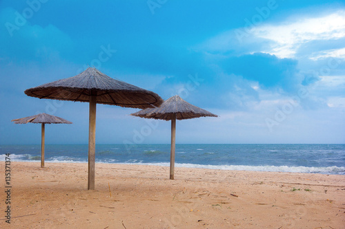 sea coast with thatched umbrellas © Angelika Smile