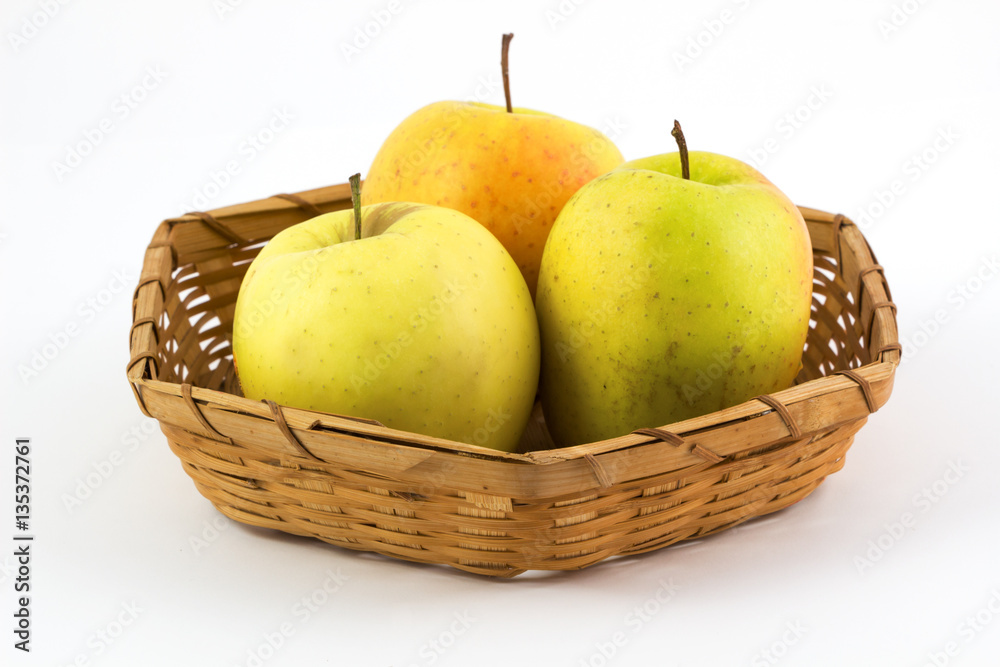 Fresh, Ripe apples in basket on white background.