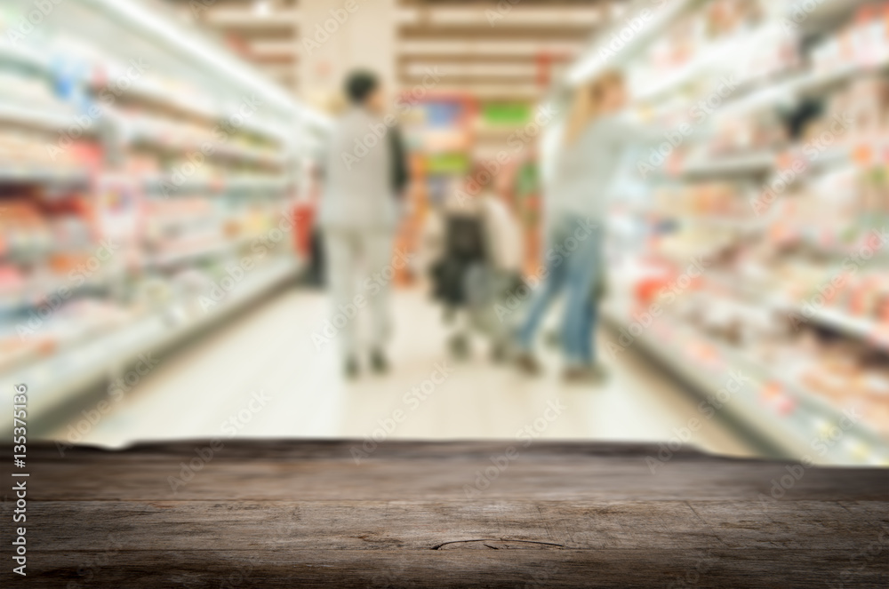 Wooden board empty table in front of blurred background. Shopping people theme. Wooden board empty table in front of blurred background. Shopping people theme.