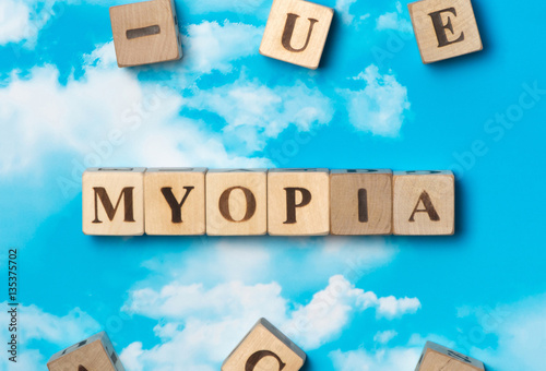 Fototapeta Naklejka Na Ścianę i Meble -  The word Myopia on the sky background