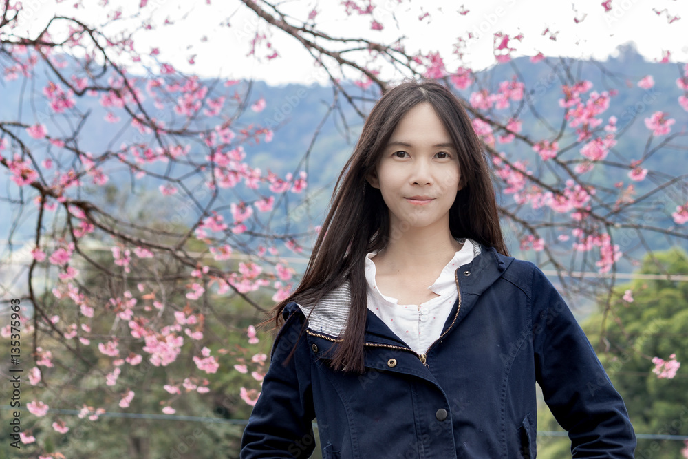 portrait of young Asian women with sakura flower portrait of young Asian women with sakura flower
