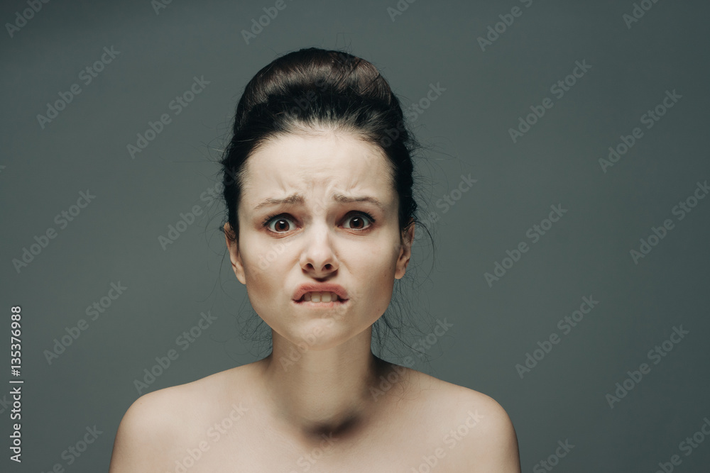 a frightened woman bit her lips a frightened woman bit her lips