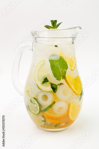 Beautiful fruit lemonade in a jar on a white background