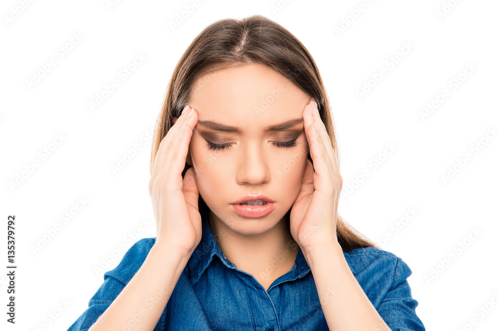 Overworked sad ill woman having strong headache Overworked sad ill woman having strong headache