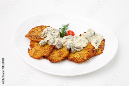 Jewish potato pancakes on white background